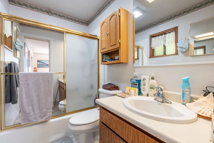 Oak vanity with an integrated sink and chrome faucet