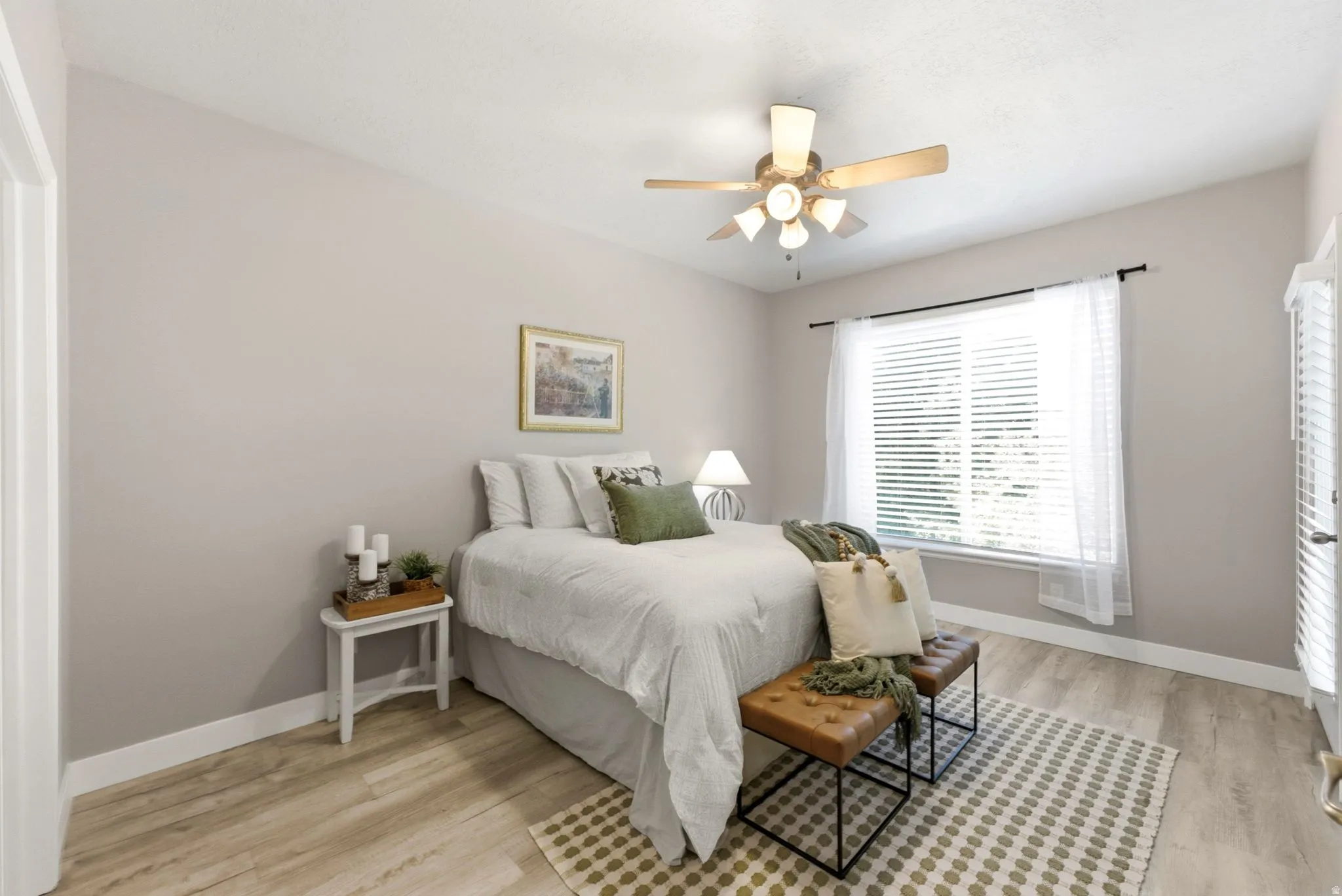 Recessed lighting, wood-finish flooring, ceiling fan, large window with blinds, and a white door with louvered panels