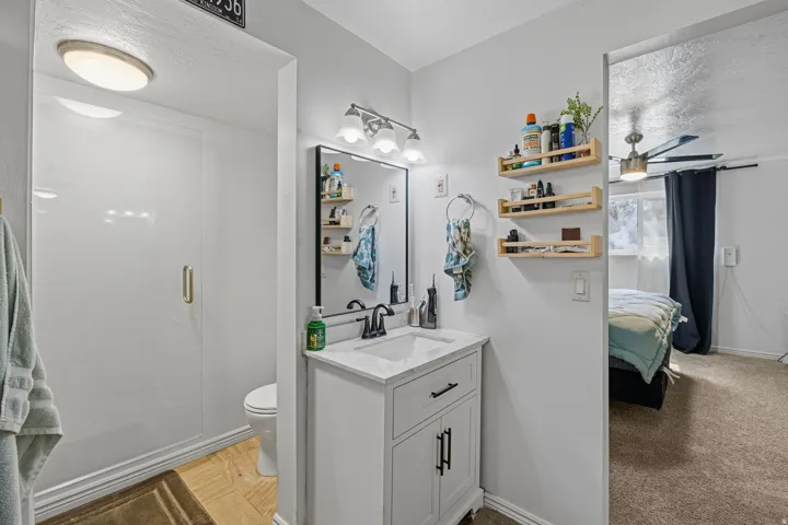 Vanity with a white countertop and black hardware