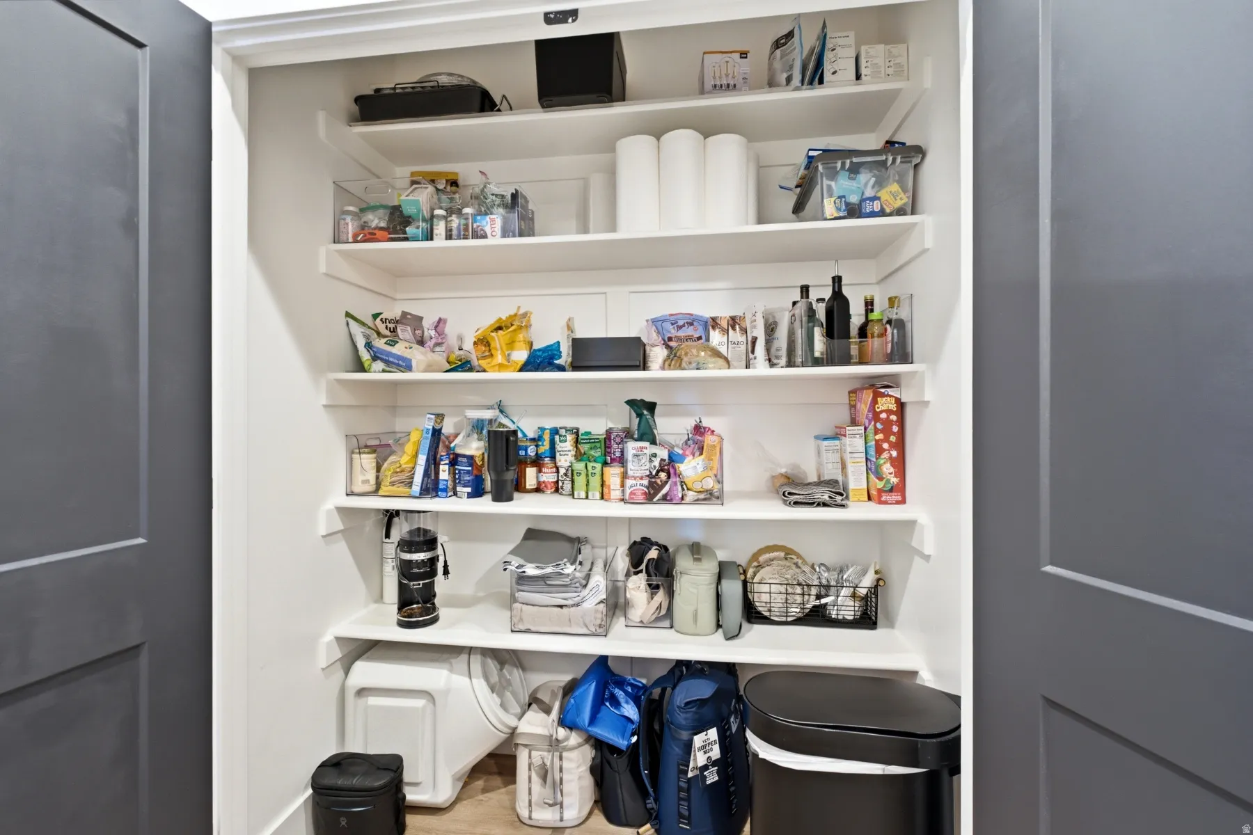 Built-in shelving with white finishes providing storage