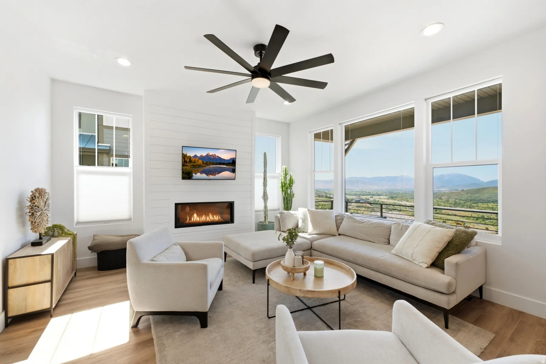 Wood-finish flooring, recessed lighting, and a modern ceiling fan