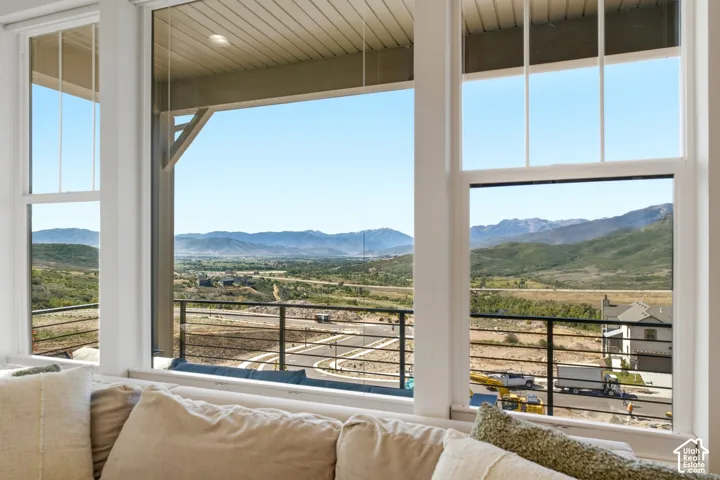 Expansive windows offering mountain scenery