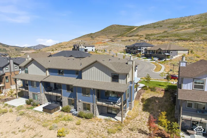 Townhome community with varied exterior finishes, stone accents, and private balconies
