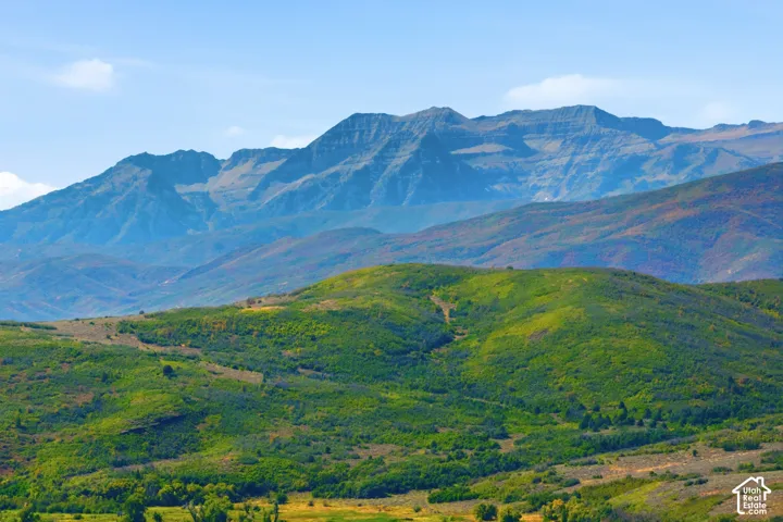 Expansive mountainous terrain with varied elevations and lush green foliage