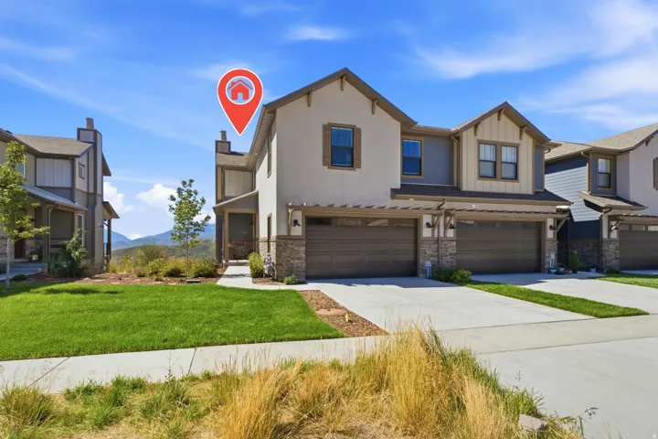 Contemporary architectural style featuring stucco and stone veneer siding