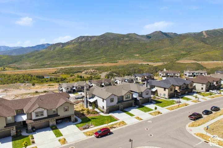 Mountainous terrain provides a natural backdrop for this residential area featuring paved streets and manicured lawns