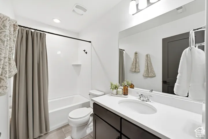 White tub/shower combination with matte black fixtures