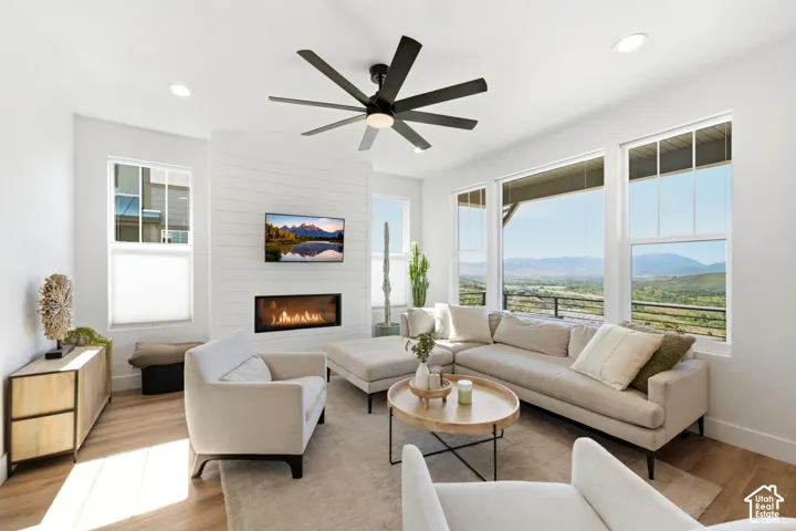 Wood-finish flooring, recessed lighting, and a modern ceiling fan