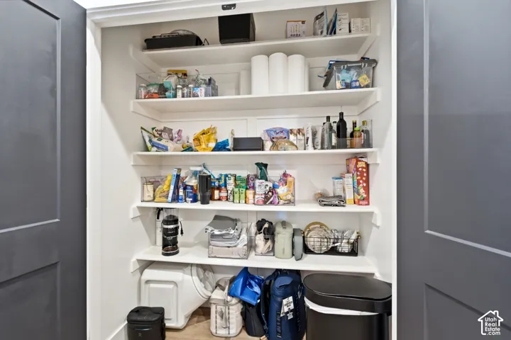 Built-in shelving with white finishes providing storage