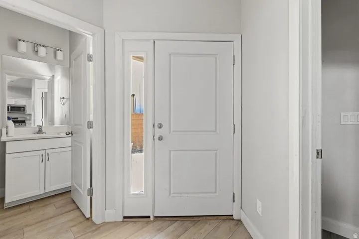 Entry door with a side light and paneled door design