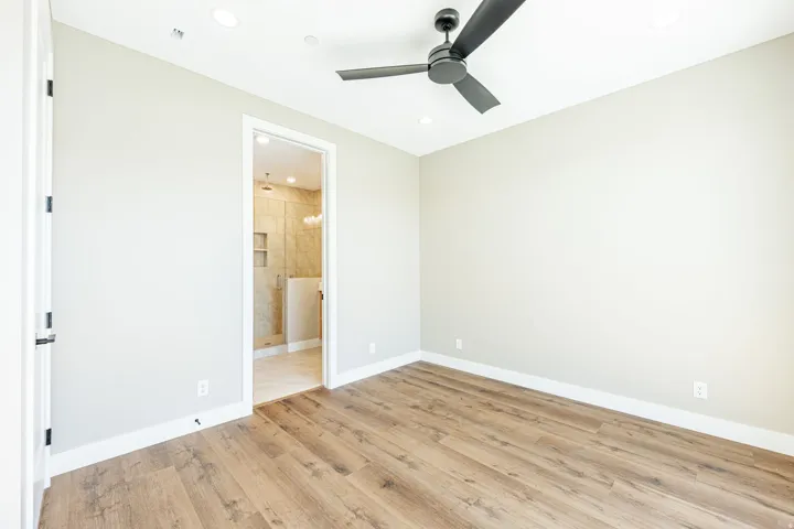 Wood-finish flooring, recessed lighting, and a ceiling fan
