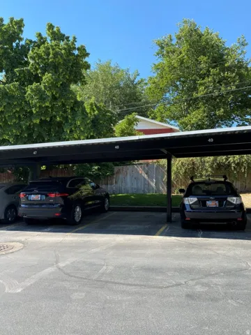 Covered parking structure with designated parking spaces