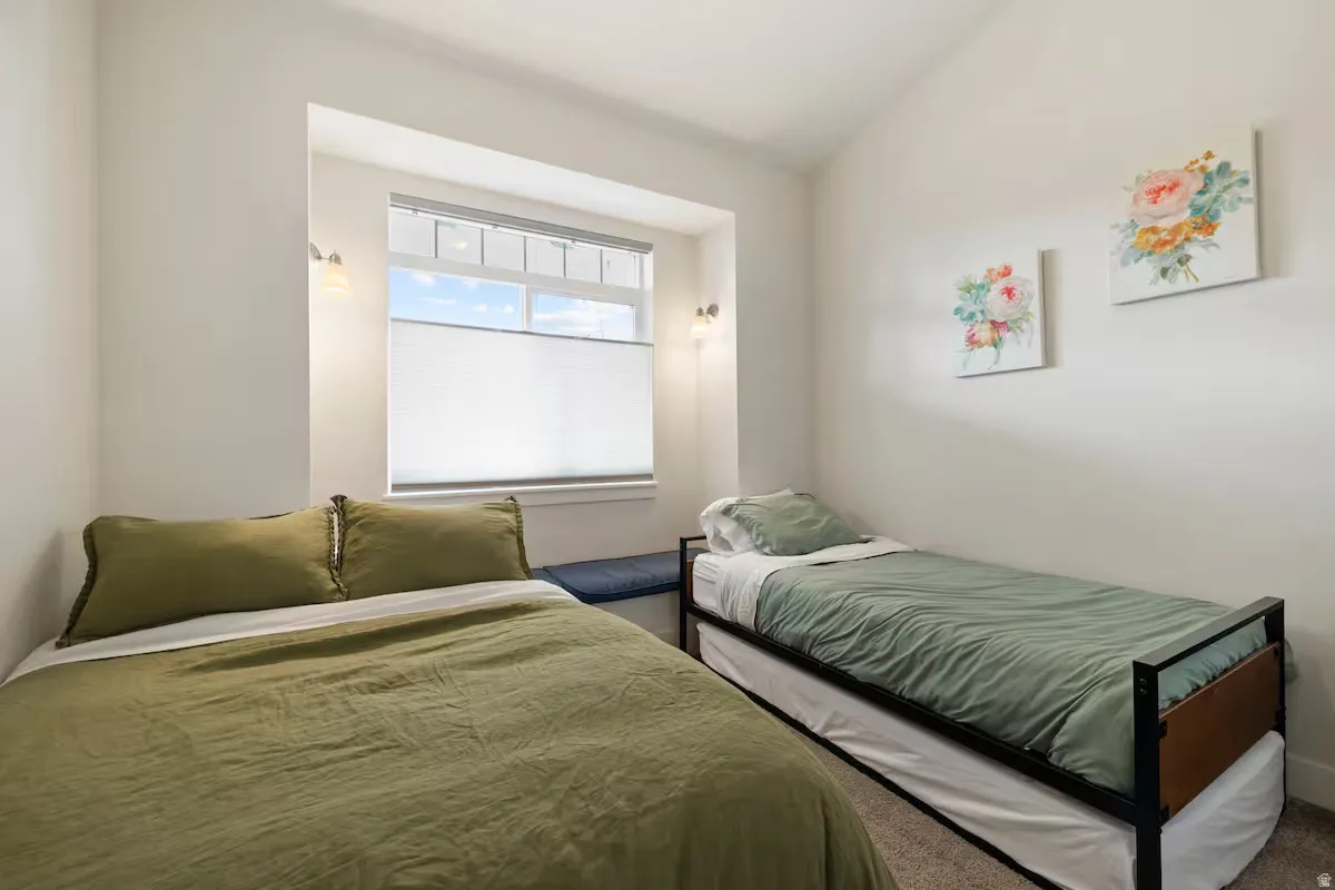Recessed window alcove with built-in bench seating and twin wall-mounted sconces