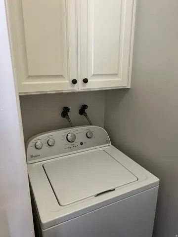 White shaker-style cabinetry with dark hardware
