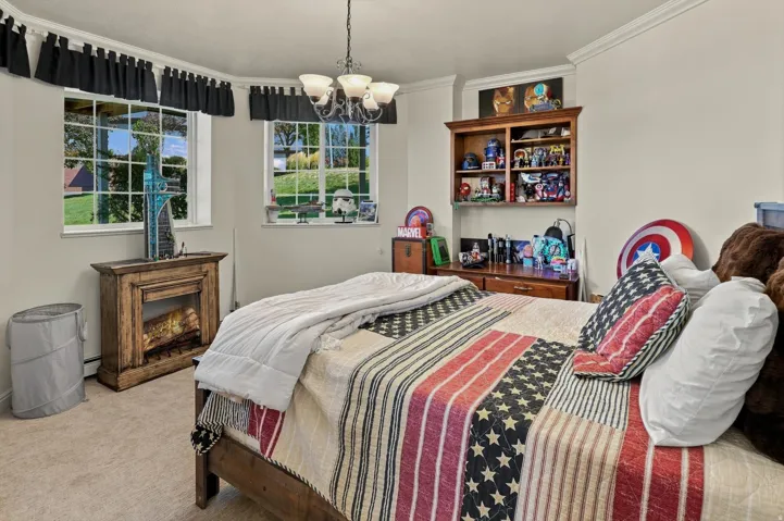 Recessed lighting, crown molding, double pane windows, and a built-in shelving unit