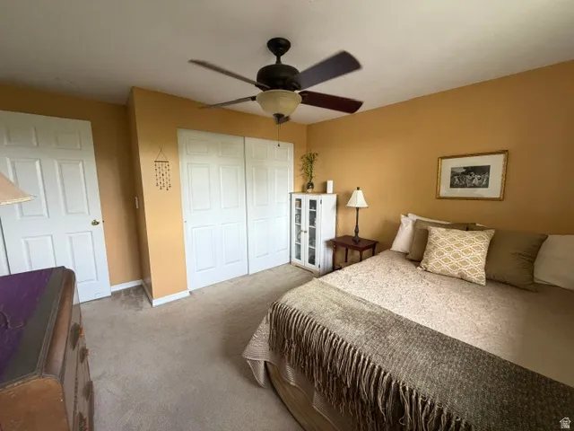Recessed ceiling fan with integrated lighting, paneled interior doors, and neutral carpeting throughout