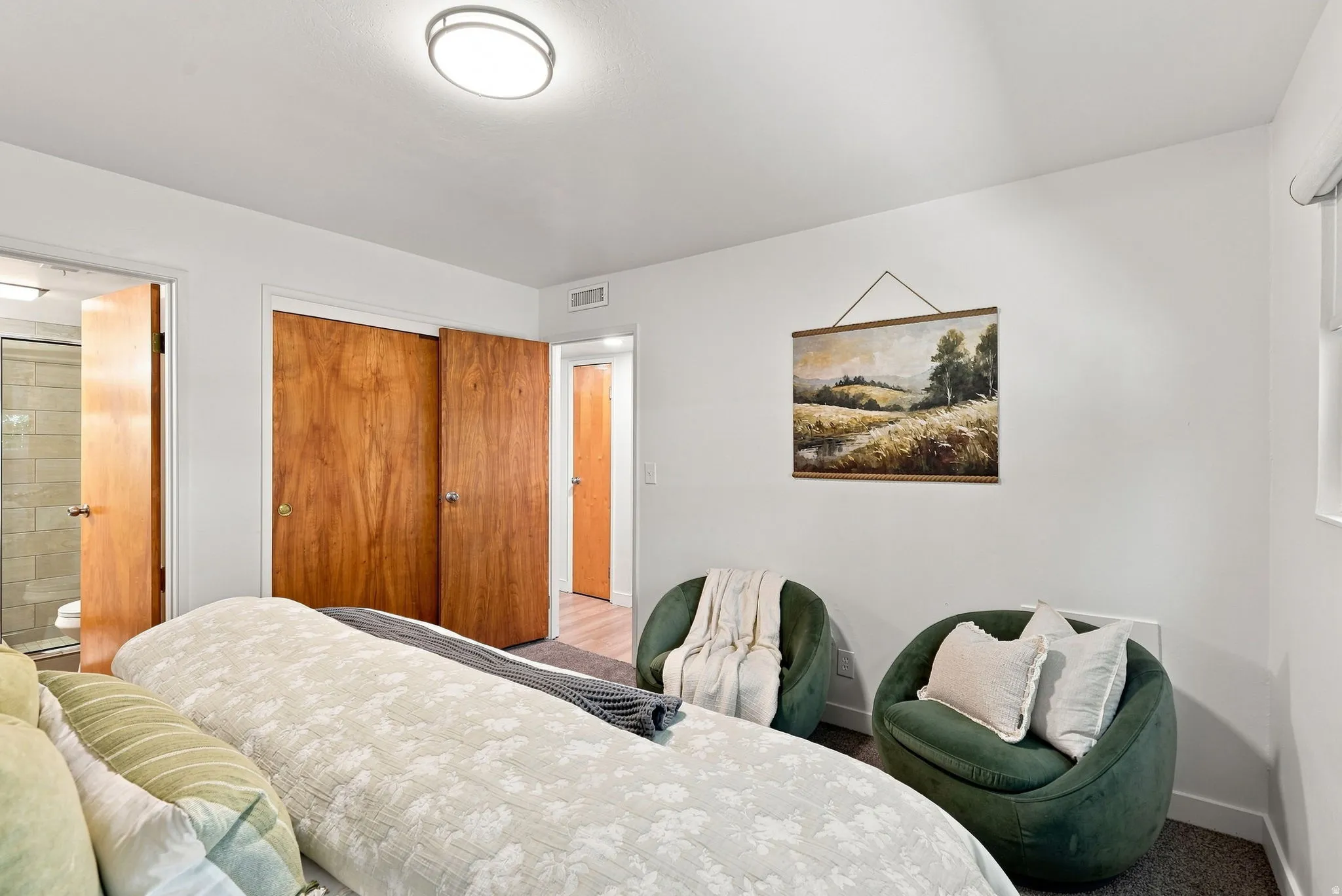 Recessed lighting and dual wood-panel closet doors