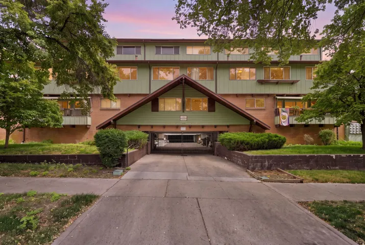 Multi-story building featuring brick and horizontal siding