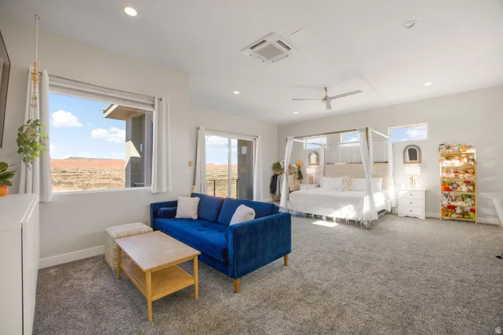 Plush carpet flooring, recessed lighting, and a ceiling fan