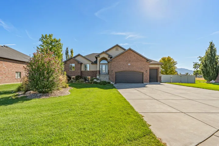 Brick and stucco exterior with an arched entryway