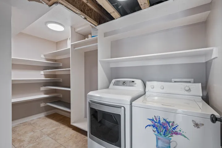 Tile flooring with a built-in shelving system and overhead lighting