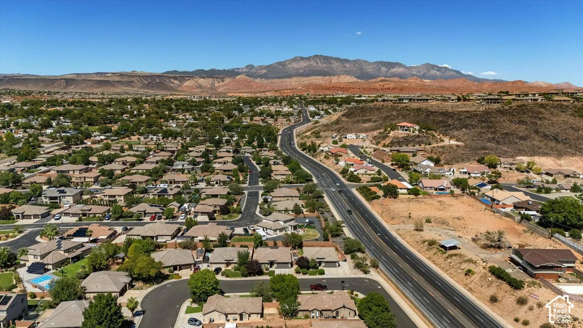 Residential neighborhood with extensive landscaping and a prominent roadway