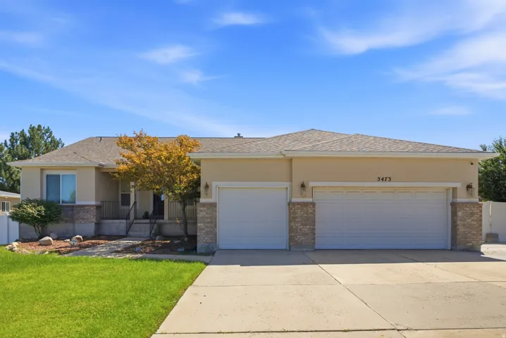Exterior with stucco finish and stone accents