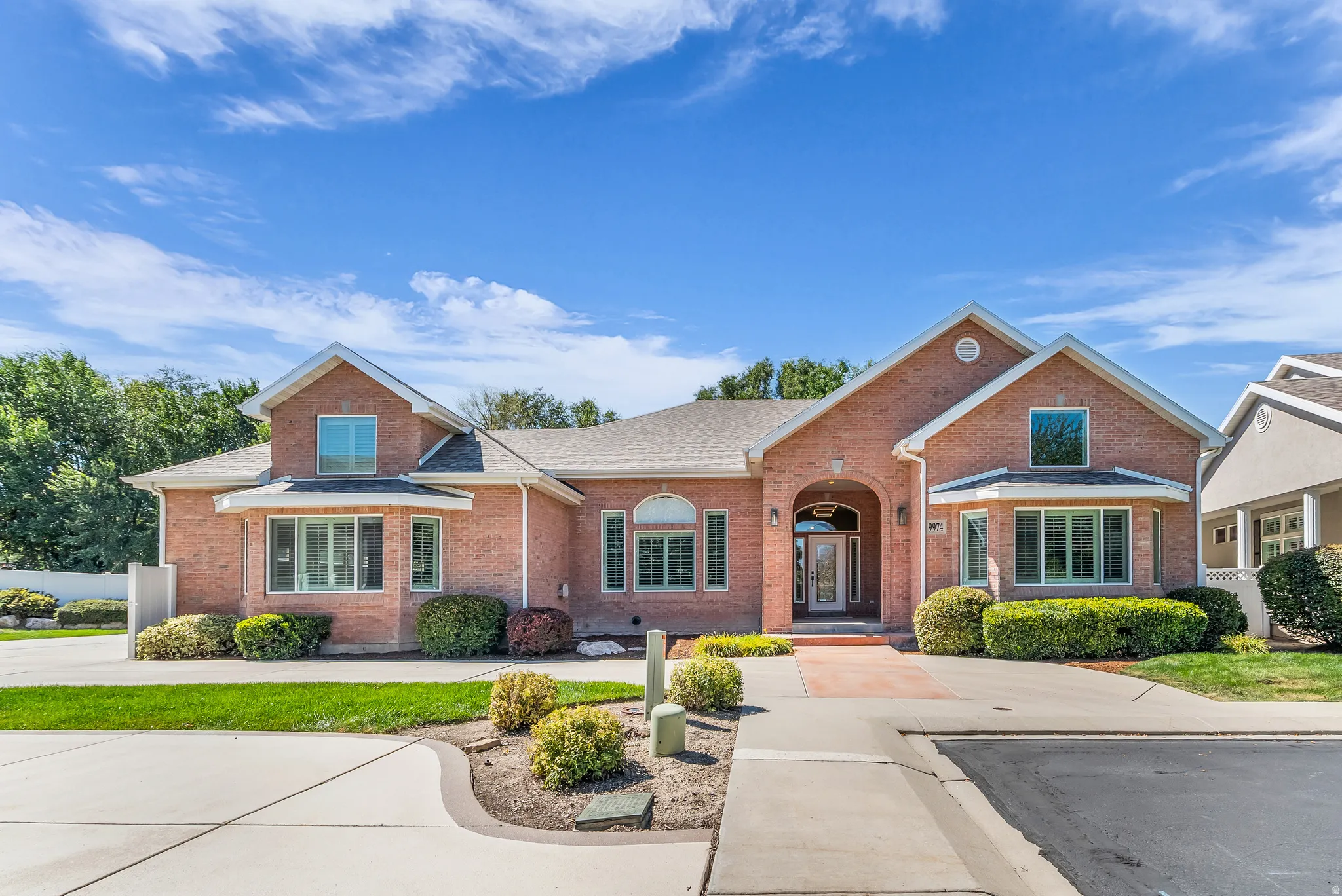 Brick exterior with multiple gables and a covered entry