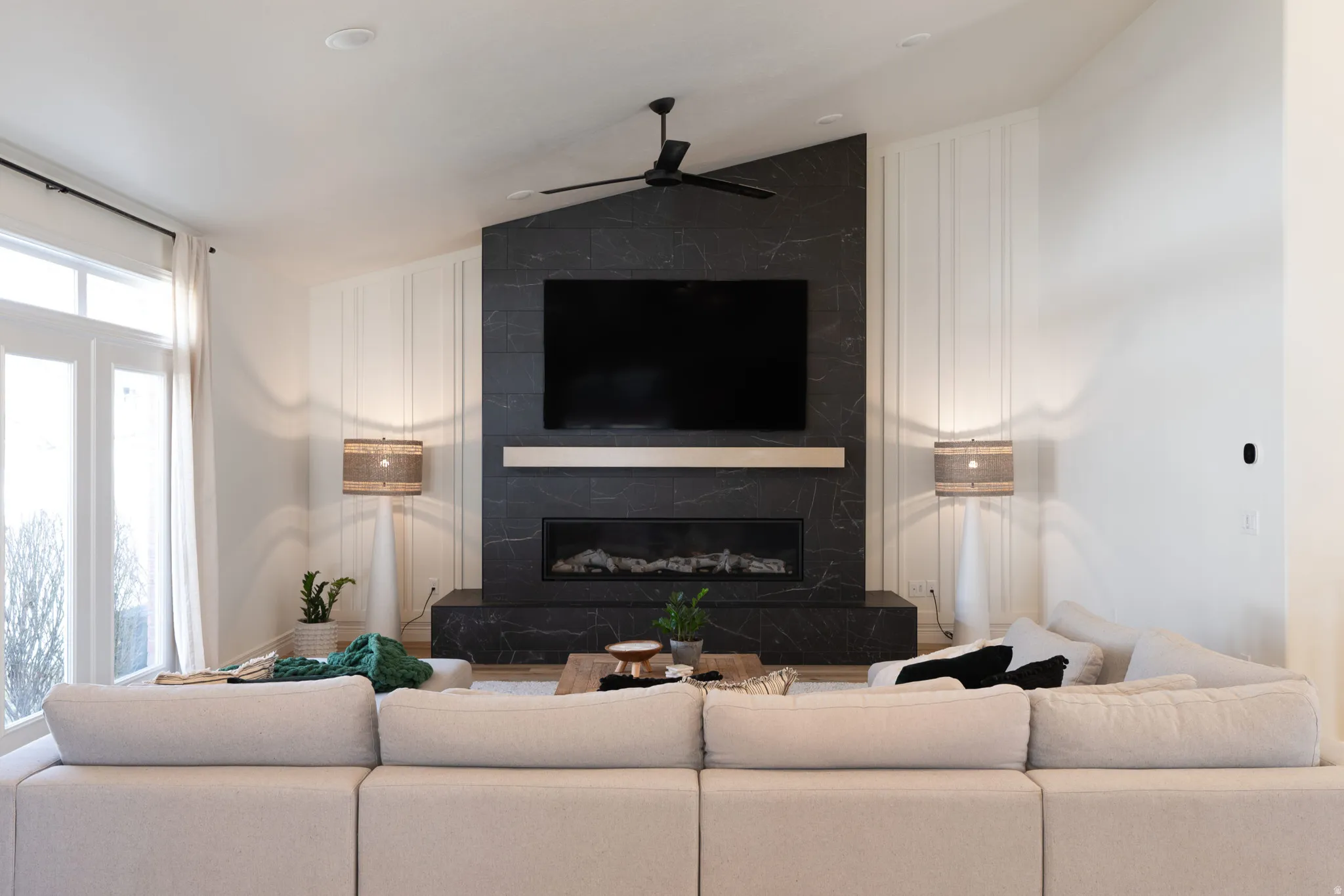 Soaring vaulted ceiling with a modern ceiling fan