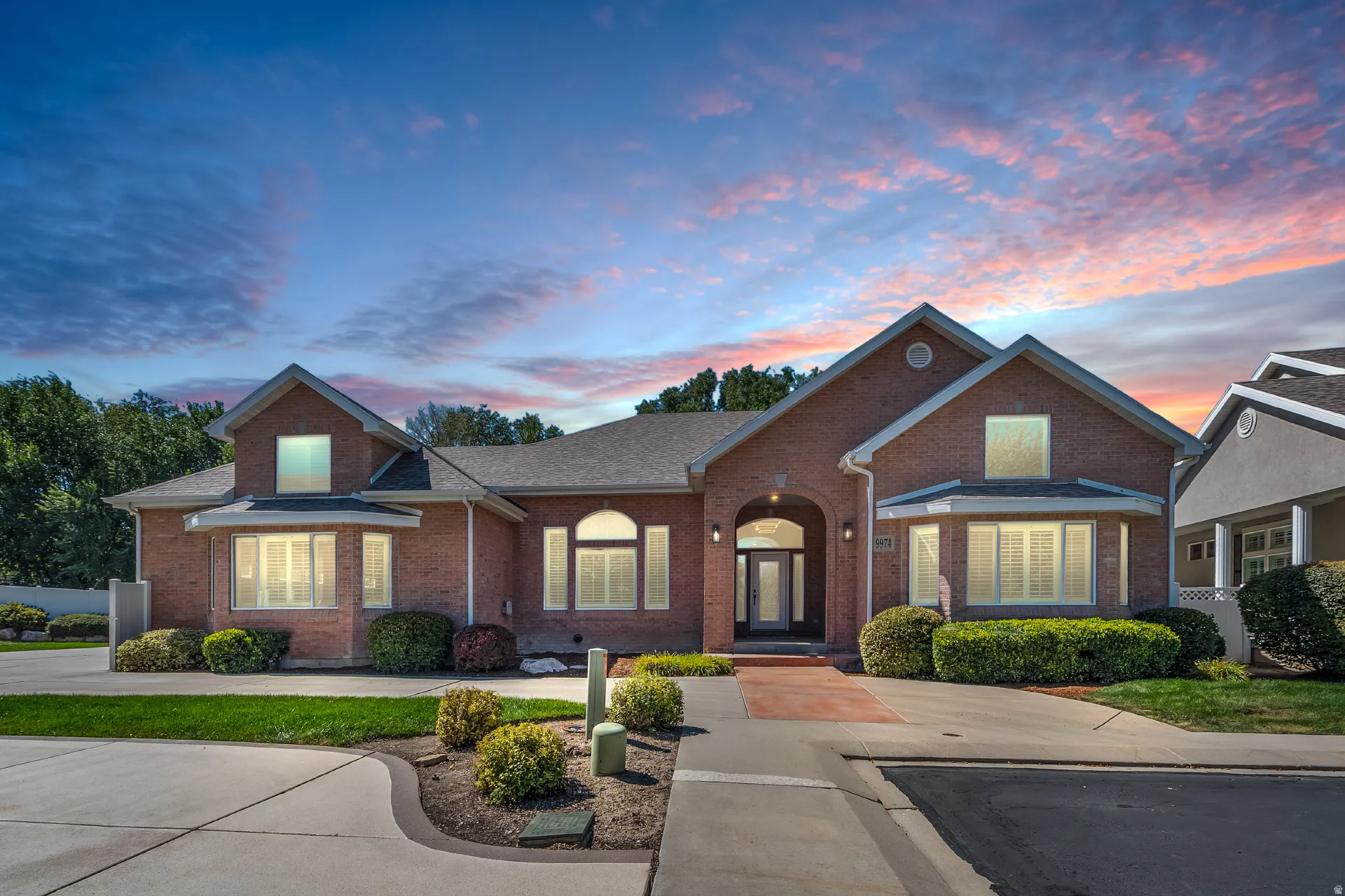 Brick exterior with multiple gables and a covered entry