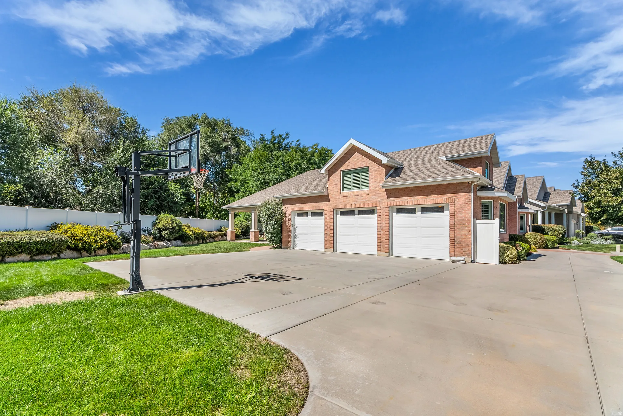 Brick exterior with a multi-car garage