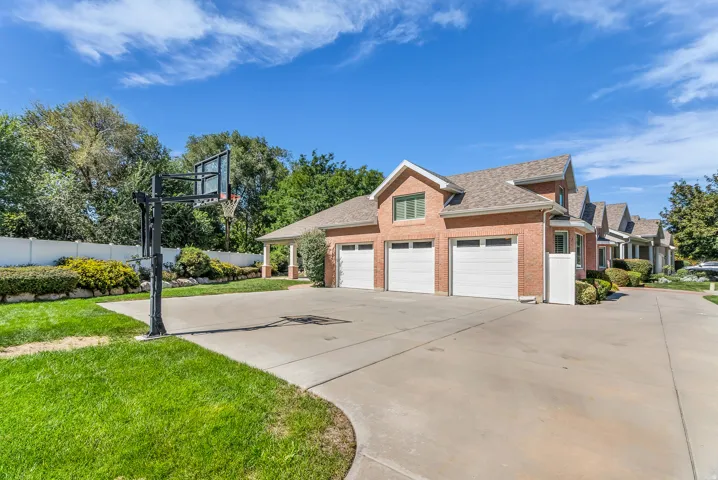 Brick exterior with a multi-car garage