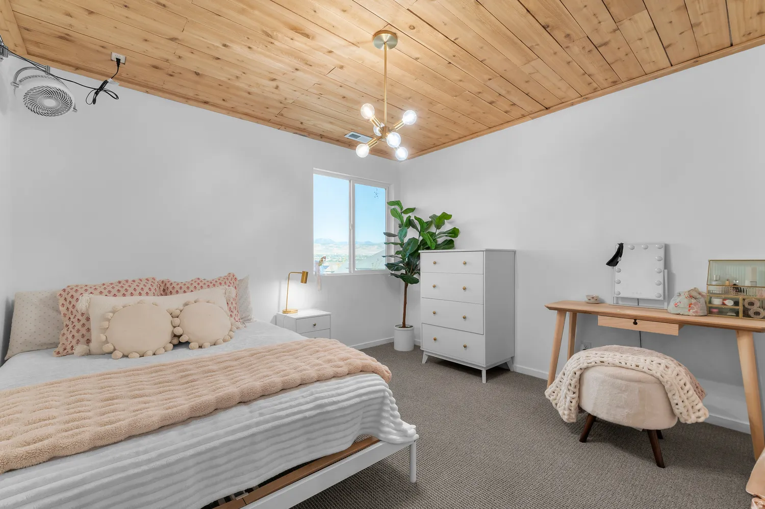 Wood-plank ceiling, recessed lighting, double-pane window, wall-mounted light fixture, carpeted flooring