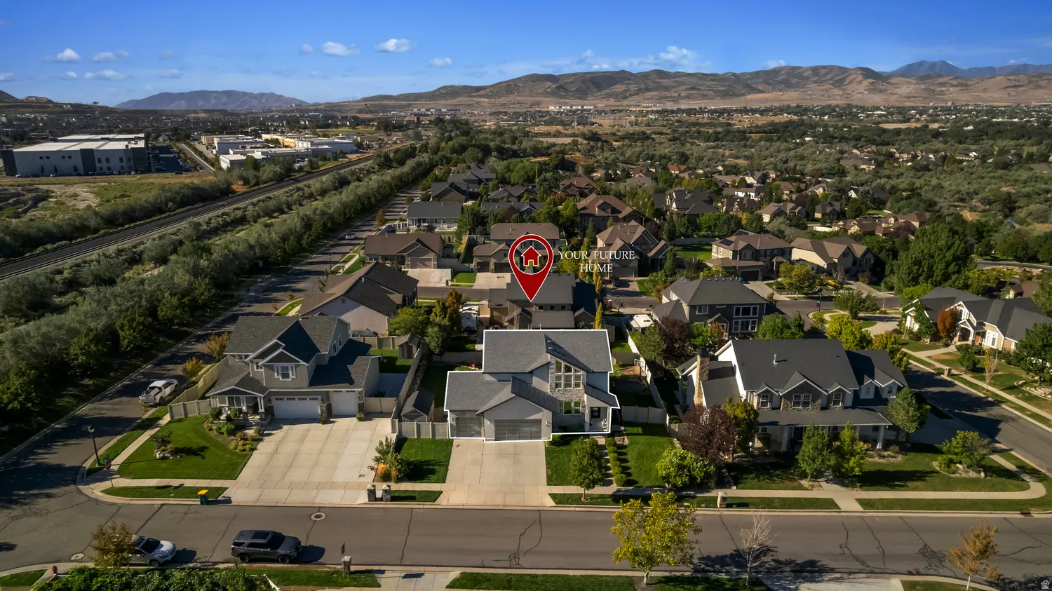 Aerial perspective showcasing residential properties with a mountainous backdrop