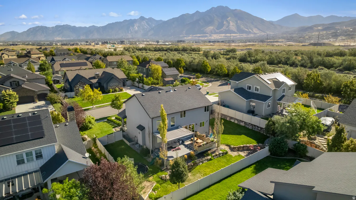 Expansive mountain backdrop with a residential neighborhood