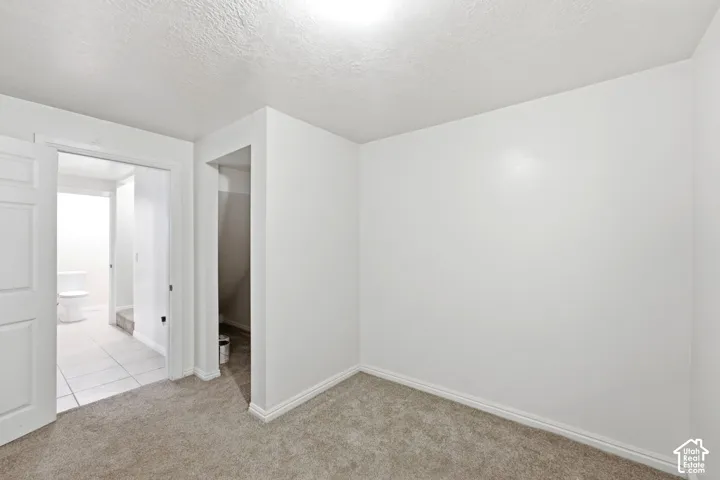 Neutral-toned carpeting paired with white walls