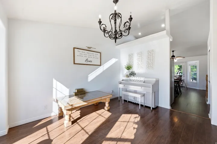 Dark wood-finish flooring complemented by white walls