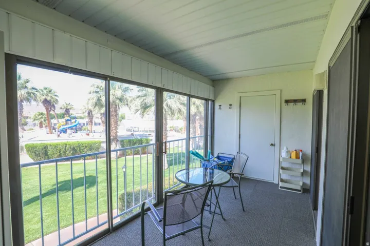Screened patio with carpeted flooring