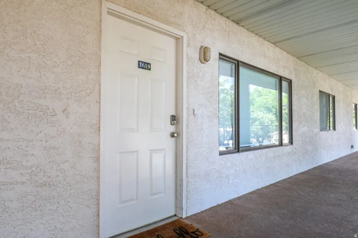 White panel door with smart lock entry