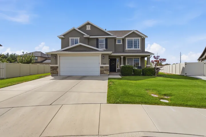 Two-story exterior with a two-car garage and a covered entry