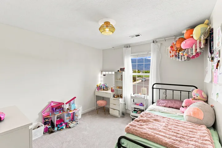 Recessed lighting, wall-to-wall carpeting, and a window with mountain scenery