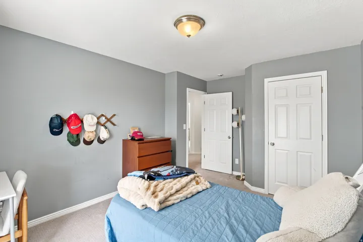 Recessed lighting, neutral wall tones, carpeted flooring, and paneled interior doors