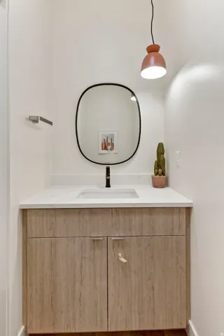 White countertop with an integrated sink and matte black faucet