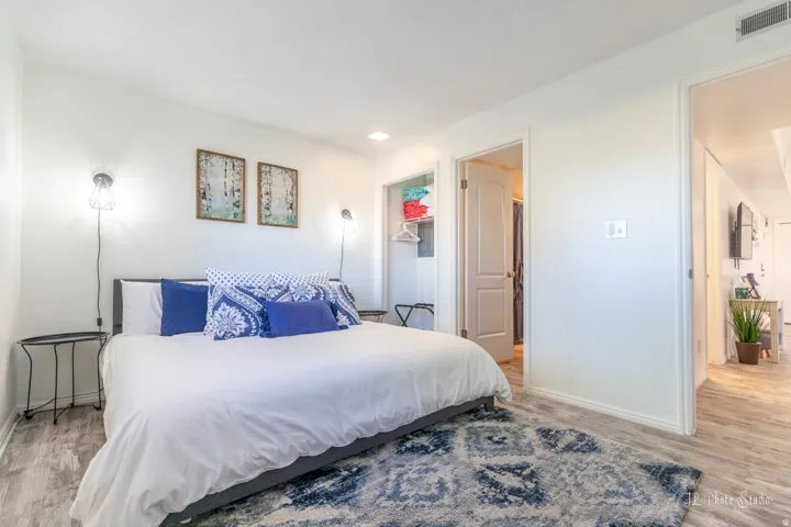White walls and wood-finish flooring provide a neutral backdrop