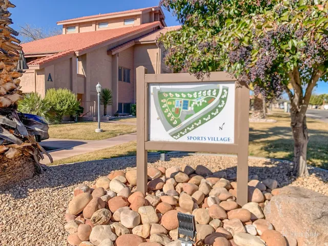 Building exterior featuring a tiled roof and stucco finish
