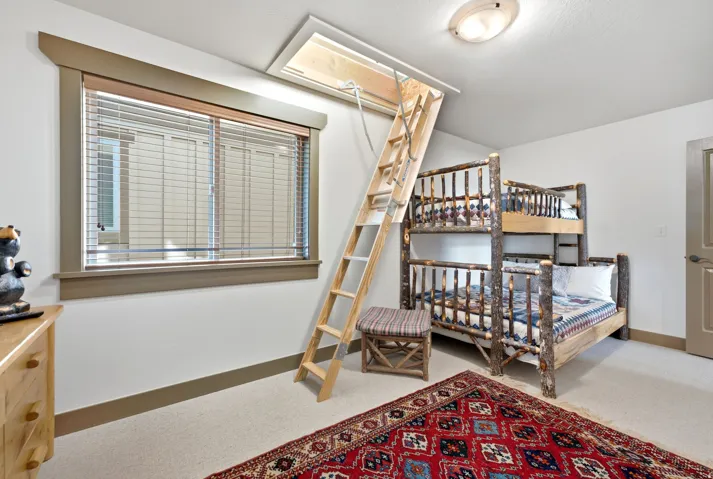 Recessed window with wood-trim framing and horizontal blinds