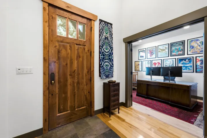 Craftsman-style wood entry door with clear glass panels