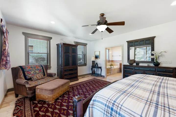 Recessed lighting, ceiling fan, and wood-finish flooring