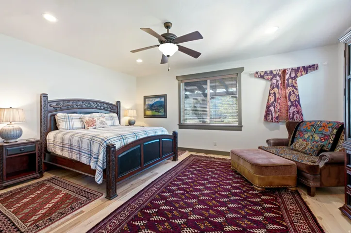 Recessed lighting, ceiling fan with light fixture, wood-finish flooring, window with blinds, and contrasting window trim