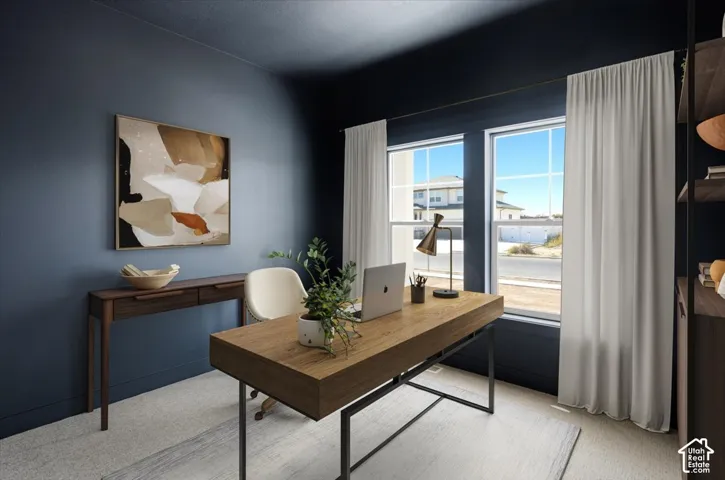 Dark-toned wall finishes, dual windows with grid detailing, and neutral wall-to-wall carpeting